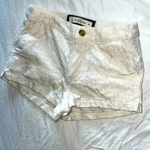 White and gold lace shorts